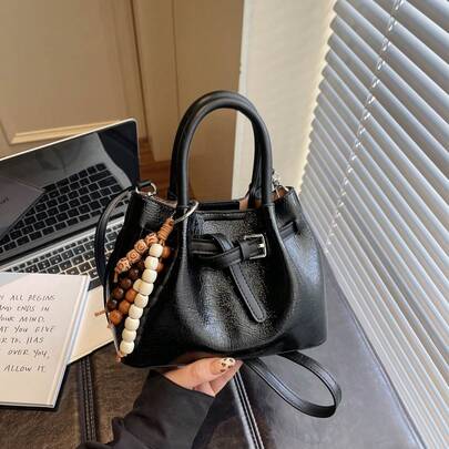 复古串珠抽绳水桶包亮面皮革手提包斜挎包小众设计迷你女包。