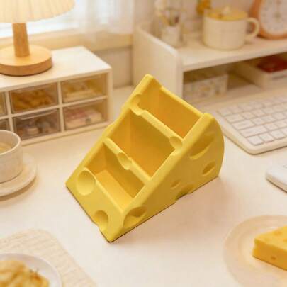 这款造型奇趣的奶酪形遥控器收纳架，适用于客厅、卧室和办公室——轻巧便携，让遥控器整齐有序、方便取用且安全无虞；可爱时尚的家居装饰品，是电视柜、沙发边桌、床头柜和办公桌的理想收纳之选；春季、情人节和母亲节的完美礼物；也是厨房台面收纳小家电和配件的绝佳选择；实用便捷，让日常使用不再杂乱。