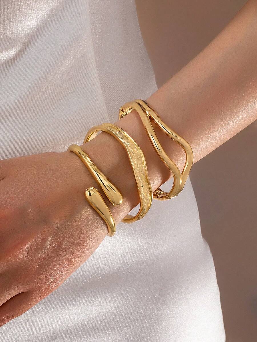 Bộ 3 vòng tay kiểu dáng tối giản mạ vàng, thiết kế bất đối xứng hình giọt nước, chất liệu dày dặn, bền chắc, làm từ kim loại nặng và hợp kim kẽm, thích hợp cho nữ giới. - Vàng - Xem 1