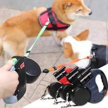 双犬伸缩牵引绳，带手电筒和便便袋分配器，360°旋转防重双牵引绳，适用于两只狗狗，一键刹车反光尼龙材质，适合小型、中型和大型宠物。 - 彩色 - 查看 3