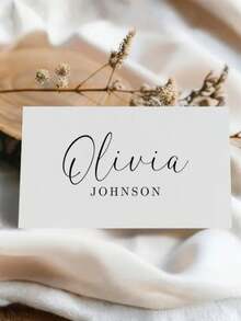 1张定制婚礼姓名卡 - 可编辑桌号卡 | 现代简约设计，黑白配色，心形图案内含姓名首字母 | 适用于婚礼、活动、派对的个性化座位卡 | 9*10厘米，铜版纸 | 可选1张或10张套装 | 完美适用于招待会、新娘送礼会、九月婚礼季派对 | 送给新娘、新郎、婚礼策划师和宾客的理想礼物 | 精致优雅的座位卡，牛皮纸材质，婚礼季派对用品 - 客製化文字 - 查看 4