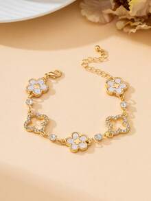 1 chiếc vòng tay nữ sang trọng, quý phái, màu vàng rỗng hình cỏ bốn lá và thánh giá khảm trắng hình cỏ bốn lá may mắn dành cho nữ. - trắng - Xem 2