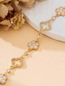 1 chiếc vòng tay nữ sang trọng, quý phái, màu vàng rỗng hình cỏ bốn lá và thánh giá khảm trắng hình cỏ bốn lá may mắn dành cho nữ. - trắng - Xem 4