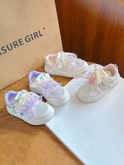 1 đôi giày thể thao trẻ em đế mềm chống trượt có nơ, kiểu dáng lưới, thoải mái, nhẹ, thoáng khí, phù hợp cho mọi mùa.