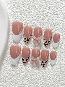 Bộ 10 móng giả polygel họa tiết da báo, bao gồm móng giả acrylic, nơ màu be, họa tiết da báo đen nâu, họa tiết gợn sóng trắng, kèm dụng cụ làm móng (1 miếng dán gel + 1 dũa móng). Có 3 hình dạng: hạnh nhân, mỏ vịt, hình quan tài. Thích hợp cho sử dụng hàng ngày, dự tiệc, chụp ảnh, đi làm vào mùa xuân/hè. Món quà tuyệt vời dành cho phụ nữ và các cô gái. - Nhiều màu - Xem 12