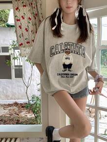 Camiseta de manga corta de diseño suelto y casual con estampado de letras y dibujos animados de cuello redondo para mujer, nueva para el verano - Gris claro - Ver 1