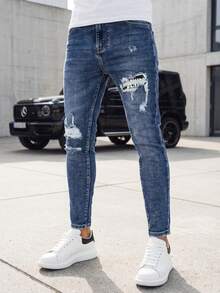 Calça jeans masculina slim-fit com detalhes desgastados e rasgados, pernas ligeiramente afuniladas, fechamento com zíper, 5 bolsos, jeans stretch com reforço em viscose, calça streetwear masculina, acabamento lavado, áreas desgastadas com forro. - Azul - Ver 3