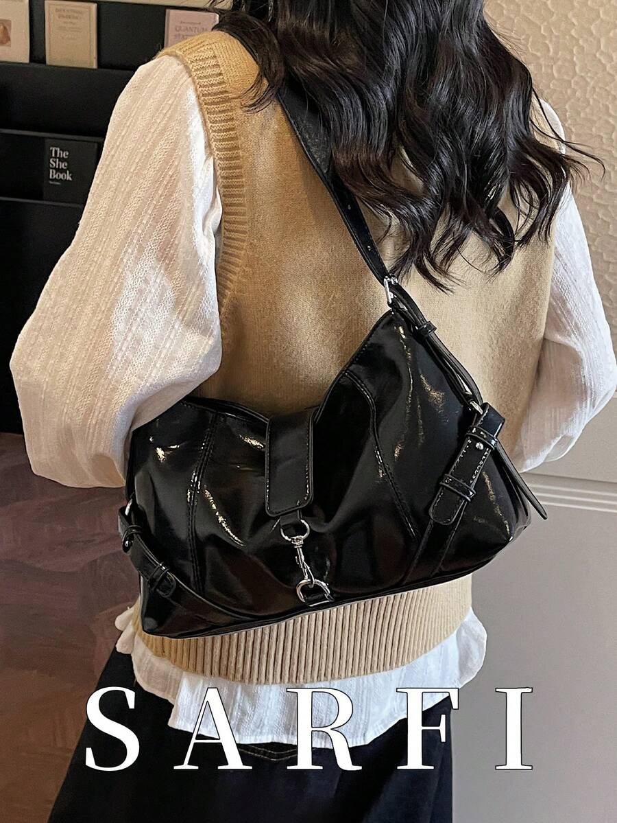 This Fashionable Modern Women's Shoulder Bag Features Metal Decorative Straps, A Unique High-End Design With Metal Buckle Details, And A Contemporary Commuter-Style All-Black Color Scheme.