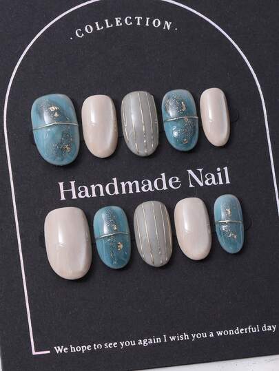 10pcs/Set European And American Handmade Short Oval Nail Caps In Y2K Blue Style & 3D Handcrafted Gold Leaf Embossed Lines & Hand Painted Gradient Gold Foil Design Nail Decoration. 1 Piece Of Jelly Gel And 1 Piece Of Nail File. Perfect For Daily Life As Well As Coachella Music Festival Party Outfits, Press On Nails And Nail Care Products.