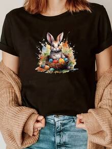 Camiseta Gráfica De Conejo De Pascua Para Mujer - Manga Corta, Cuello Redondo, Top Casual De Primavera/verano Con Diseño De Huevo Vibrante, Mezcla De Poliéster Blanco, Ligero Y Transpirable Para Ropa Casual, Top De Primavera/verano | Estampado Gráfico Juguetón | Mezcla De Poliéster - Oscuro - Ver 1