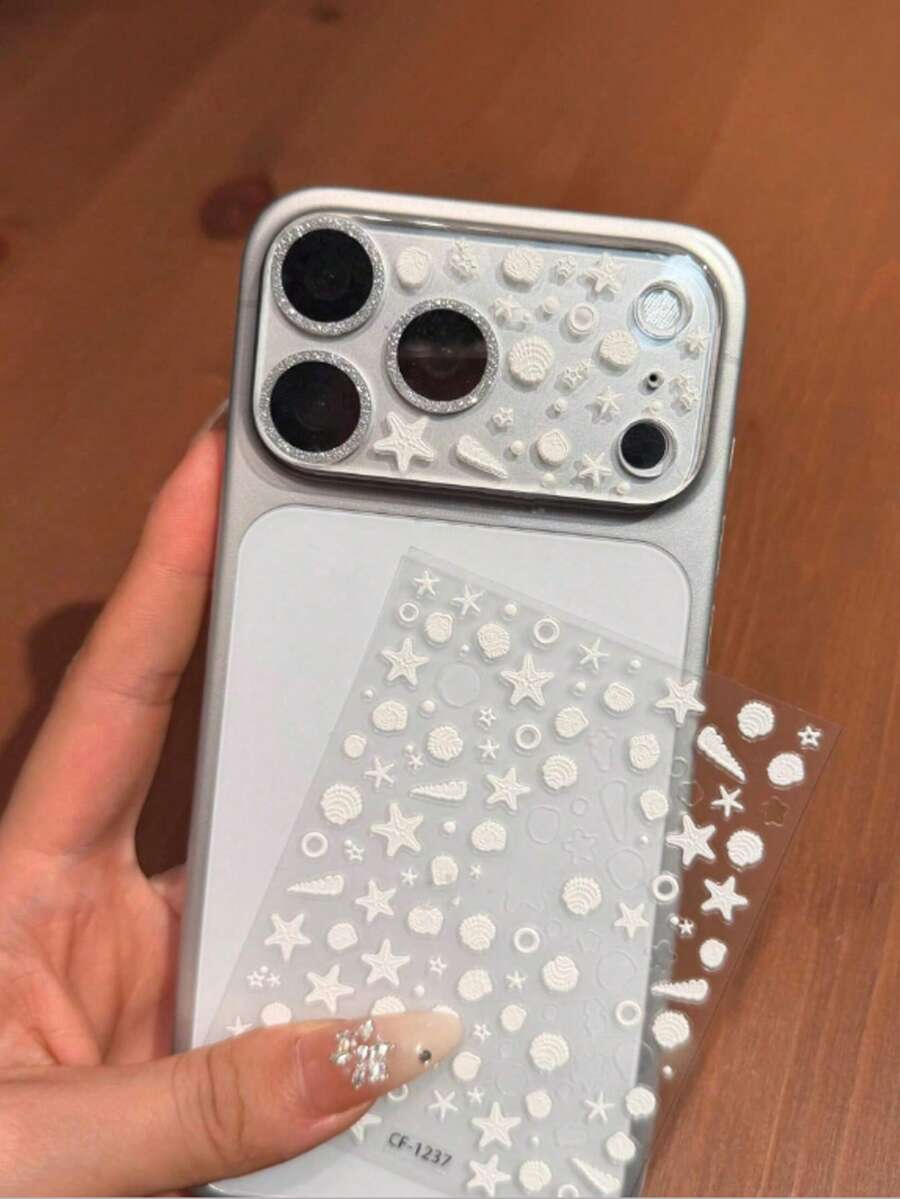 Miếng dán bảo vệ ống kính màu bạc sáng bóng + Bộ sticker tự dán, bao gồm sticker hình vỏ sò, ngôi sao và trái tim. Miếng dán bảo vệ ống kính sáng bóng đẹp mắt, tương thích với iPhone 17 Pro Max/17 Pro. Miếng dán màn hình mềm cho camera 17 inch. Miếng dán màn hình cường lực. Phụ kiện điện thoại, quà tặng mùa xuân. - Phim dán tròng kính màu bạc + hình dán ngôi sao vỏ sò - Xem 1