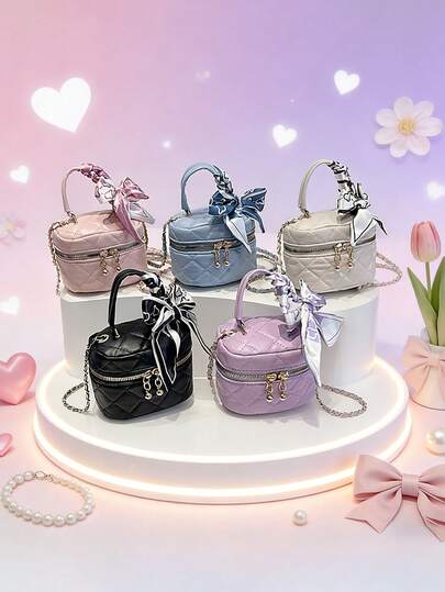 这款全新圆筒手提包可斜挎，饰有丝巾，设计休闲简约。可调节长度使其适合日常出行、购物、旅行和摄影等各种场合。轻松收纳日常必需品，是一款适合所有季节、风格和场合的多功能时尚单品。它也是一份绝佳的礼物。