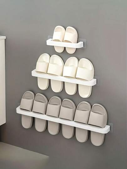 1 قطعة رف حذاء للحمام، رف حائطي للأحذية، قابل للتركيب على الحائط وبطريقة لاصقة ذاتية، اكسسوارات حمام وأدوات، مناسب للشبشب والأحذية، قابل للاستخدام في الحمام والغرفة والمنزل والسكن الجامعي. لا حاجة لثقب فتحات للتركيب، رف حذاء للحمام بلاصق غير ضار. رف أحذية للحمام، رف أحذية للحمام