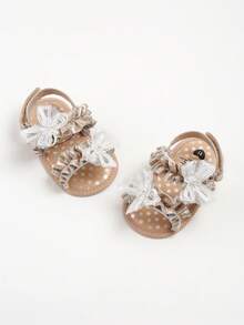 新生儿女童夏季凉鞋，花朵蝴蝶结软底婚纱平底鞋，婴儿学步鞋 - 金色 - 查看 7