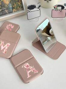 1 chiếc gương trang điểm gấp gọn cầm tay màu hồng với họa tiết chữ cái hoa hồng (A-Z), kiểu dáng đồng quê độc đáo, thời trang, chống bụi và chống nước, thích hợp sử dụng ngoài trời, được làm từ chất liệu cao cấp, thoải mái và bền. - Nhiều màu - Xem 6