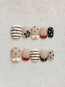 10 móng tay giả thủ công nguyên chất, móng ngắn, móng oval, nhiều màu sắc, kiểu Pháp cổ điển đen trắng phối đỏ, vẽ tay các đường sọc và hoa văn, điểm xuyết những viên kim cương nhỏ, móng tay giả dễ thương, ngọt ngào, cá tính dành cho phụ nữ và bé gái, thích hợp cho mùa xuân, hè, thu, đông, các lễ hội, tiệc tùng và sử dụng hàng ngày. - Nhiều màu - Xem 2