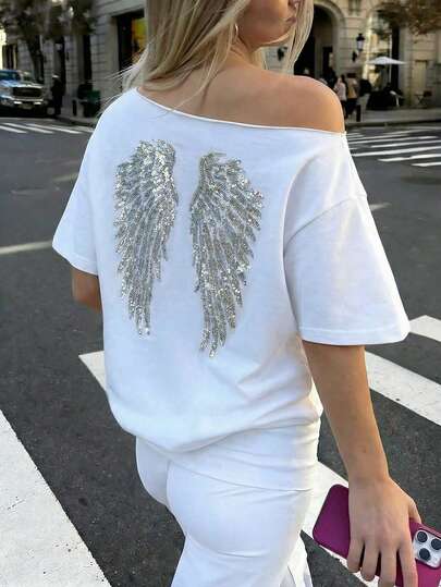 חולצת טי-שירט רחבה עם רקמת כנפי מלאך ונצנצים, כתף אסימטרית, חולצות טי גרפיות בסגנון Y2K לנשים קז'ואל