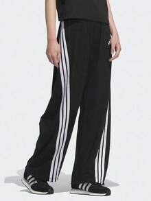 Pantalones casuales holgados con tres rayas y logo adidas BANANA KNIT JOGGERS para mujer. - Blanco y Negro - Ver 1