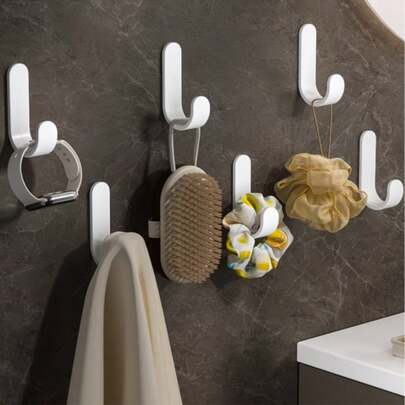 6 móc treo chịu lực cao - Lắp đặt không cần khoan, tiết kiệm không gian, lý tưởng cho lối vào, phòng tắm, nhà bếp, tủ quần áo - Dùng để treo chìa khóa, khăn tắm, áo choàng, túi xách - Lắp đặt dễ dàng bằng keo dán/vít - Móc nhựa dùng để sắp xếp nhà cửa và trang trí ngày lễ