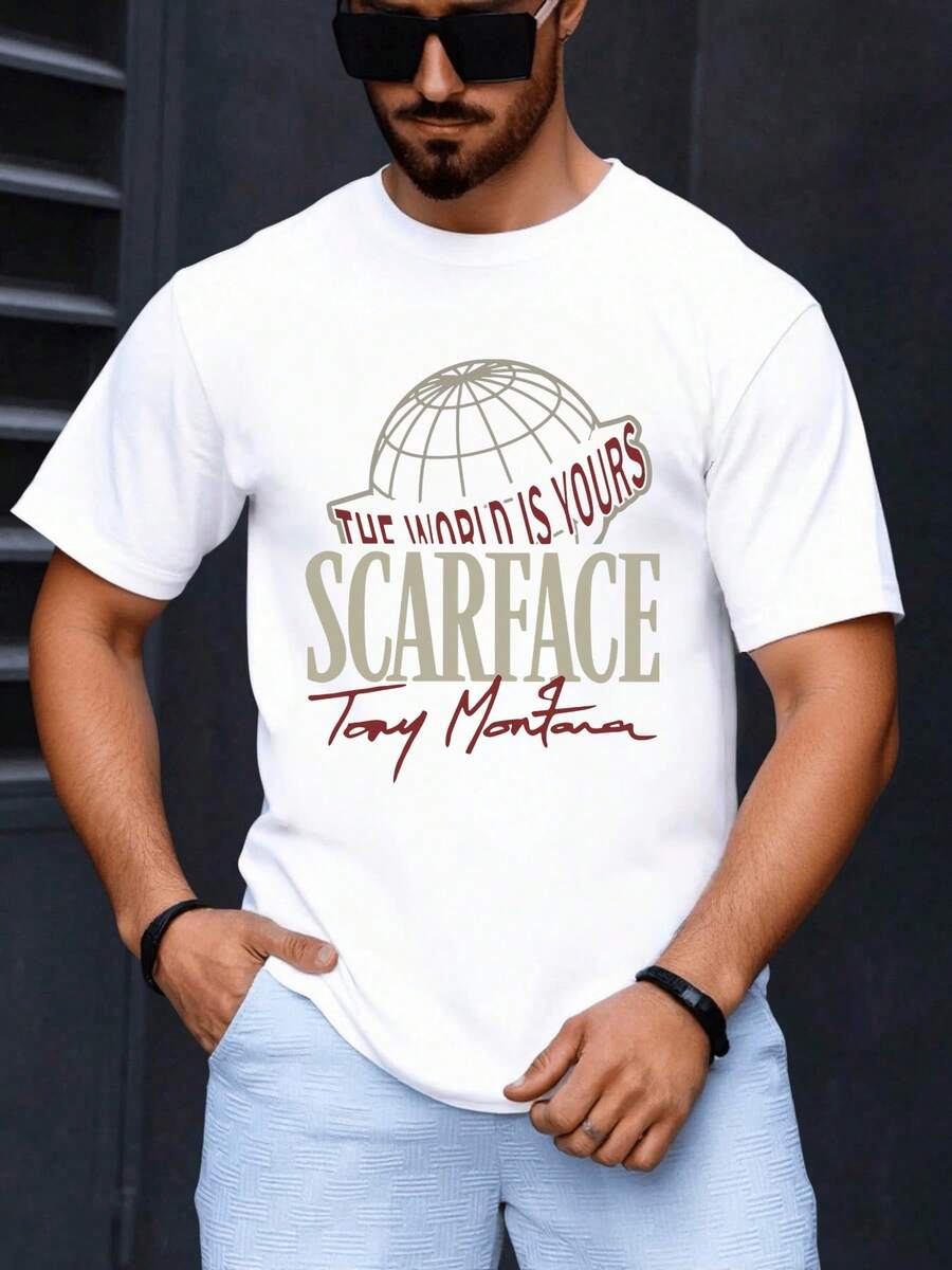 Globo con la frase el mundo es tuyo representa la ambición la fuerza y la determinación de alcanzar el éxito con tipografía grande y detalles rojos que transmiten energía moderna camiseta de hombre cómoda y casual para uso diario - Blanco - Ver 1
