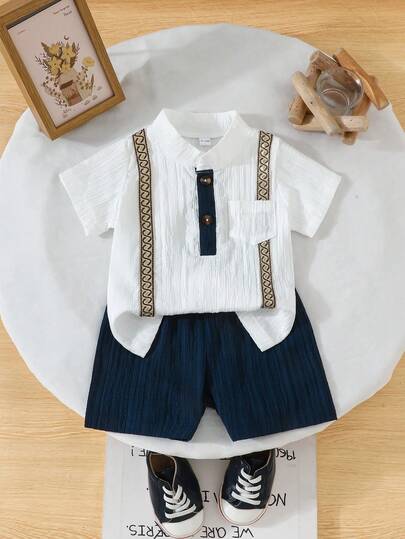 مجموعة صيفية لطفل ولد تتكون من 2 قطعة: ملابس علوية قصيرة بجيب وأزرار، وشورت بلون أحادي