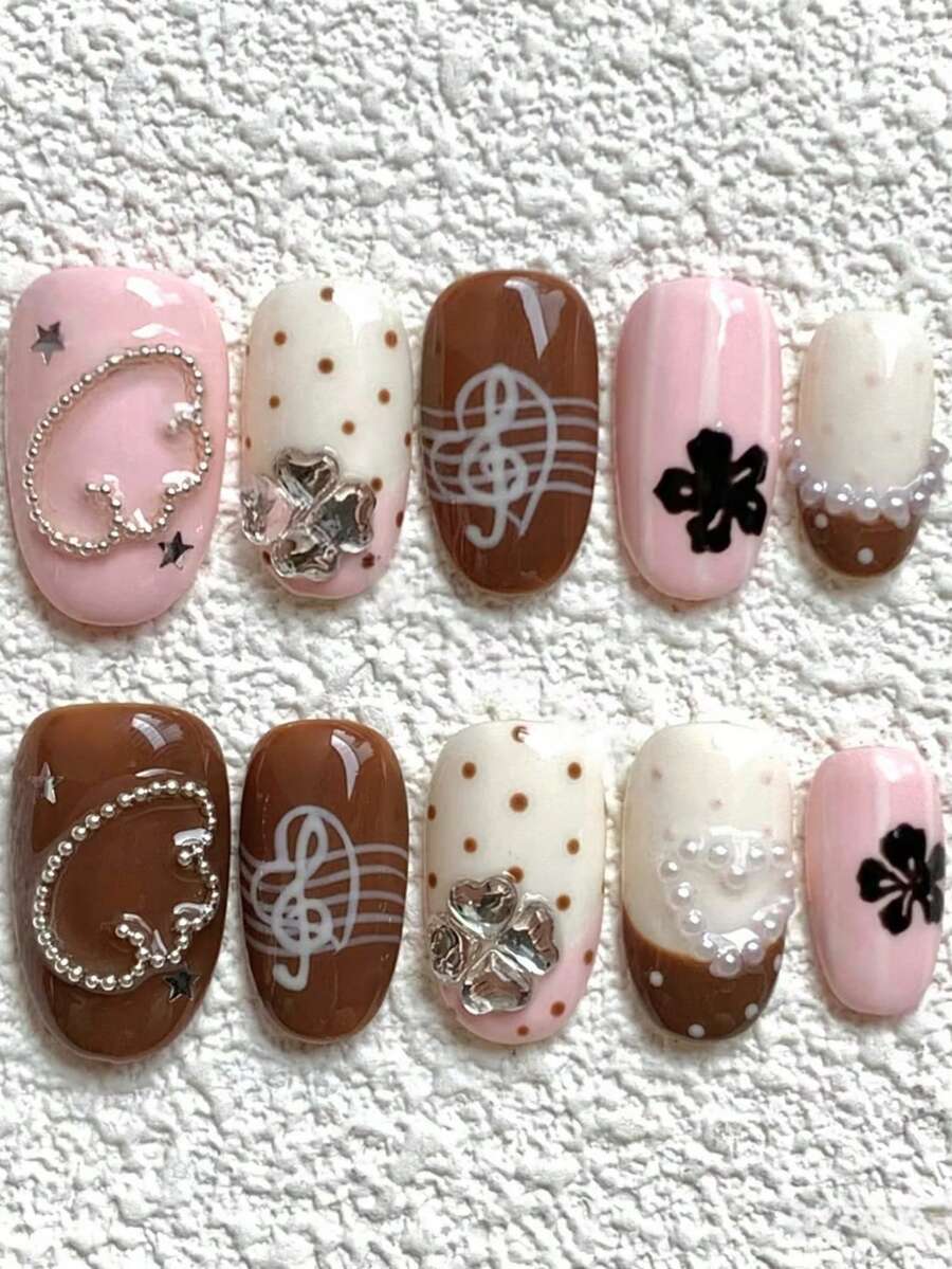10 pièces Faux ongles courts ovales roses et marrons - Style doux et délicat fait main avec motifs de clé de sol, breloques en forme de cœur en strass, accents de trèfle, pois et détails de perles , Faux ongles réutilisables et amovibles, parfaits pour les sorties, le port quotidien et les tenues décontractées , Prêts à porter en 2 minutes, sans vernis à ongles nécessaire , Comprend 1 pièce de colle de gelée et 1 mini lime à ongles - Follow Your Heart - Voir 1