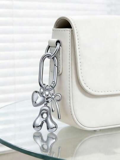 Llavero con letra inicial de burbuja de plata A-Z, llavero con inicial adorable con encanto de corazón y lazo, colgante con inicial de metal brillante, llavero con letra inicial personalizada para llaves, bolso, mochila y decoración de bolso, accesorio de bolso elegante para niñas, mujeres, amigos, perfecto para uso diario, escuela, viajes, compras, regalo lindo para el Día de San Valentín, cumpleaños, Navidad, graduación, aniversario, idea de regalo festivo