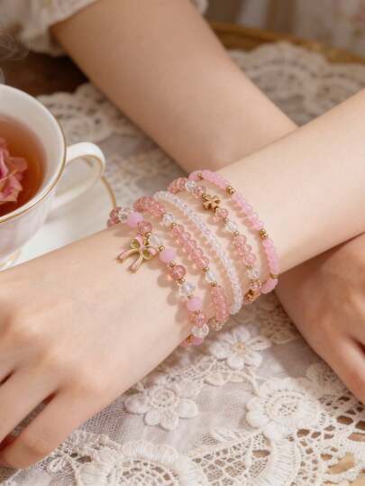 5件套时尚优雅精致不对称珍珠、十字架、蝴蝶结吊坠手链套装，适合女性日常、休闲、派对、音乐节、海滩度假等场合佩戴，亦可作为礼物。