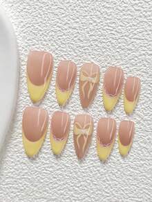 10件套甜美夏日风亚克力美甲套装，包含手绘黄色蝴蝶结、黄色蕾丝法式甲片，可爱甜美风格，附赠美甲工具（1个果冻贴纸+1个指甲锉），3种甲型可选：杏仁形、鸭嘴形、棺材形，适合日常、派对、拍照、春夏、外出等场合。 - 彩色 - 查看 11