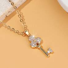The Gold Collar Chain Is Set With Small Diamonds, Giving A Luxurious Touch. It Is Perfect For Daily Wear And Makes An Excellent Gift For Special Occasions. - Three-leaf Key Pendant - View 6