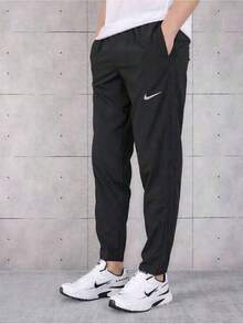 Nike Essential 长款抽绳跑步休闲裤，男女通用，黑色，BV4834-010 - 黑色 - 查看 1