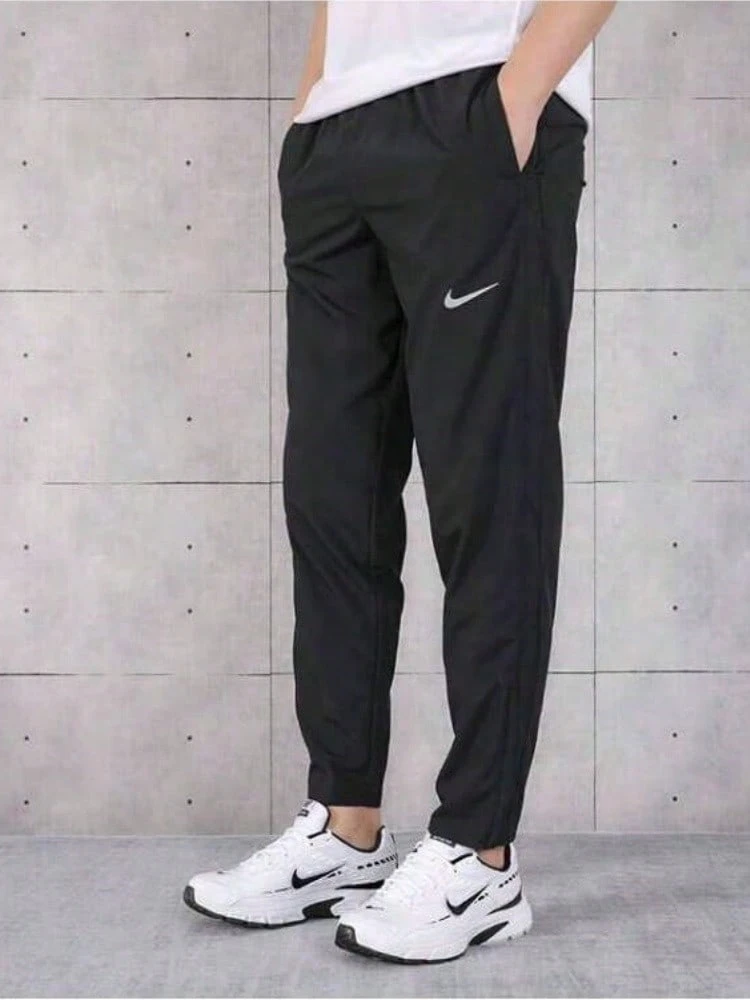 Nike Essential 长款抽绳跑步休闲裤，男女通用，黑色，BV4834-010 - 黑色 - 查看 1