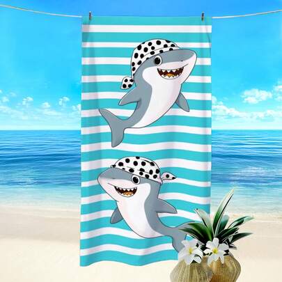 1条条纹卡通鲨鱼印花沙滩巾，超强吸水速干，柔软轻便，适合游泳、沙滩、游泳、户外露营旅行，是理想的沙滩必备品。