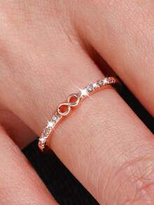 1枚优雅立方氧化锆无限符号戒指，适合作为情人节、婚礼、订婚、周年纪念派对的礼物送给女性。 - 玫瑰金色 - 查看 6