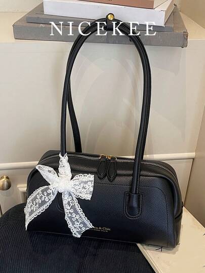 时尚大容量简约纯色单肩包，小巧设计，日常搭配蕾丝蝴蝶结装饰腋下包，个性百搭的女士波士顿包，适合通勤上班、日常外出和聚会等场合。