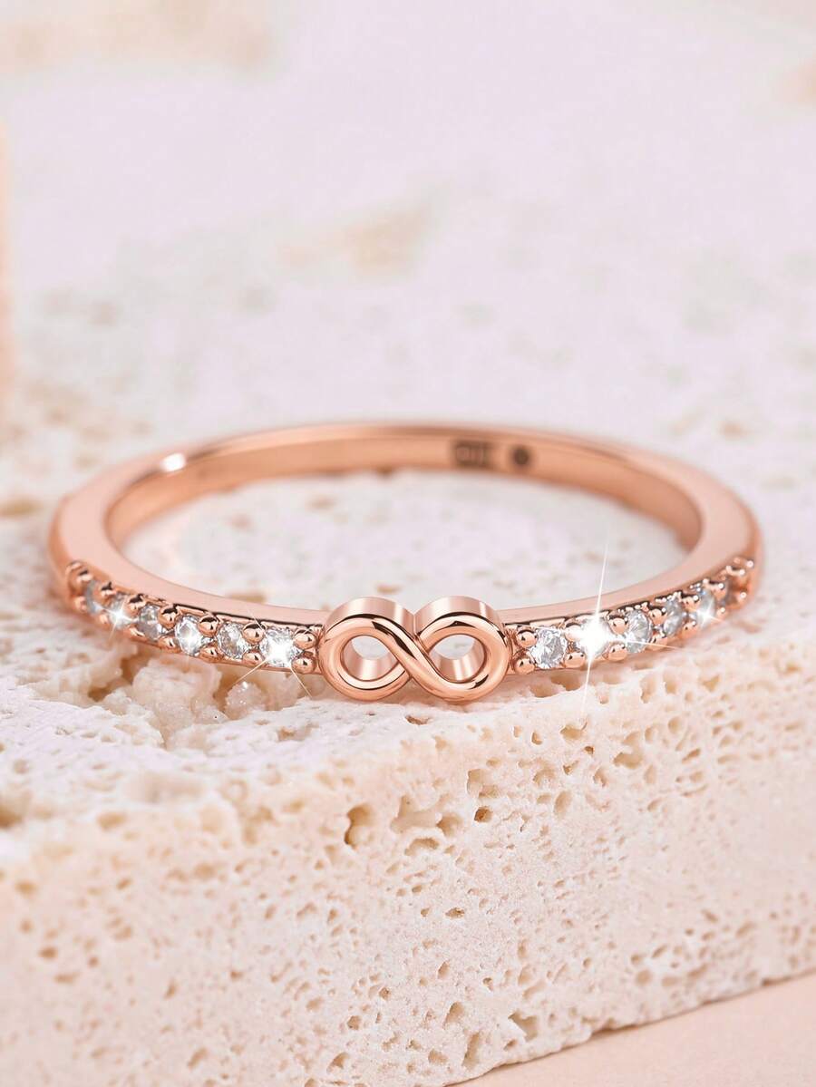 1枚优雅立方氧化锆无限符号戒指，适合作为情人节、婚礼、订婚、周年纪念派对的礼物送给女性。 - 玫瑰金色 - 查看 1