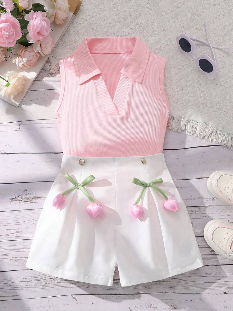 Bộ 2 món thời trang gồm áo dệt kim không tay cổ bẻ màu trơn và quần short ống rộng màu trơn có cúc và nơ trang trí hoa, thích hợp mặc hàng ngày cho các bạn nữ tuổi teen vào mùa hè. - Hồng - Xem 1