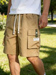 Pantalones cortos cargo de verano para hombres con cintura elástica, diseño de múltiples bolsillos, corte holgado para uso casual y uso diario al aire libre - Caqui - Ver 1