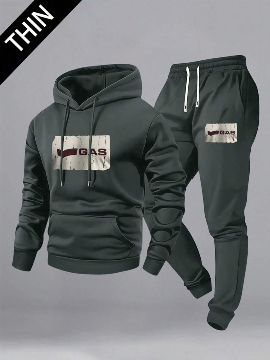 男士连帽卫衣和运动裤两件套，春秋季节的理想之选。包含一件轻便的连帽卫衣和一条运动裤，采用复古字母印花设计。适合休闲外出、居家穿着、周末出行，甚至轻松的办公环境。 - 彩色 - 查看 1