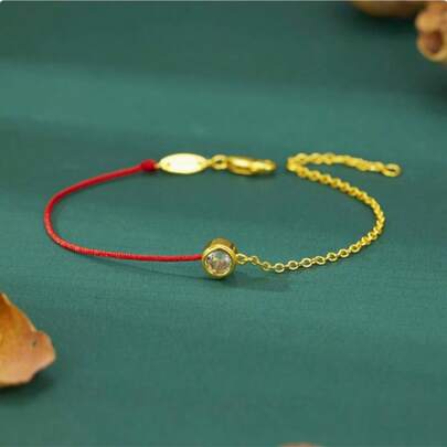 玫瑰金镀层铜单钻红绳手链，牛年幸运符