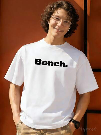 Nouveau t-shirt 2026 avec logo Bench central, style décontracté classique, 100 % coton, pour homme. Ce t-shirt polyvalent peut se porter sous un autre vêtement ou comme veste. Idéal pour les balades en ville, le shopping ou les pauses café. Un cadeau parfait pour les hommes.