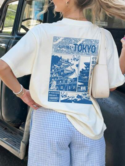 Áo thun nữ "Tokyo Japan" họa tiết sóng lâu đài, dáng regular fit, phong cách retro Nhật Bản, áo tay ngắn màu xanh dương thoải mái, cổ tròn độc đáo, phong cách đường phố phóng khoáng, thời trang thường ngày lấy cảm hứng từ Pinterest.