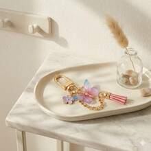 36 pezzi/12 set Portachiavi a forma di farfalla, set regalo per matrimonio e festa, include sacchetti in organza, biglietti di ringraziamento, anelli in metallo, nappine, adatto per matrimoni, feste, decorazioni per compleanni - Portachiavi con nappa a forma di farfalla rosa e blu - Visualizzare 9