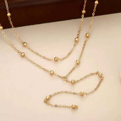 قطعة واحدة لباس علوي كاميسول نسائي فاخر عالي الجودة متعدد الطبقات مزين باللؤلؤ، معقود يدويًا، بتصميم عصري وجذاب، مع سلسلة جسم من اللؤلؤ الصناعي، وقصة قصيرة أنيقة، ونمط جديد مريح، وقميص داخلي بسيط مزين باللؤلؤ الصناعي، وسلسلة صدر مرصعة بالألماس، وسلسلة لباس علوي، ومناسبة لفساتين الزفاف وحفلات النوادي الليلية.