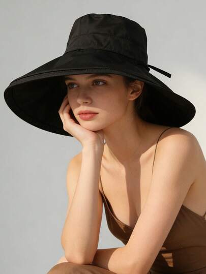 1顶女士休闲宽檐遮阳帽，适合夏季日常户外活动