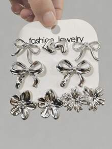 10件套全新简约高端UV镀层CCB树脂耳环套装，包含五瓣花、蝴蝶结和迷你心形几何耳环，是馈赠亲朋好友的优雅礼物。 - 銀色 - 查看 2