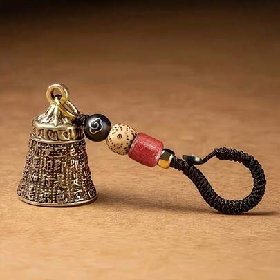 1 قطعة سلسلة مفاتيح جرس قديم مصنوع يدويًا، مع حبل مضفر وخرز - تصميم منقوش معقد، خرز أحمر وأسود، غطاء ذهبي، جرس بشعار بوذي، للحظ الجيد، السفر، التخييم وهدايا العطلات، اكسسوار السفر | قلادة فنية | مجوهرات الخرز