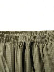 Pantalones cargo casuales para hombres con dobladillo con cordón, multibolsillos, pantalones ligeros y texturizados 3/4 para senderismo - Verde militar - Ver 5