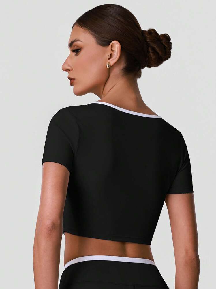 Sodalemon Camiseta corta de manga corta para mujer, cuello cruzado hueco, top corto ajustado para yoga y gimnasio - Negro - Añade 7