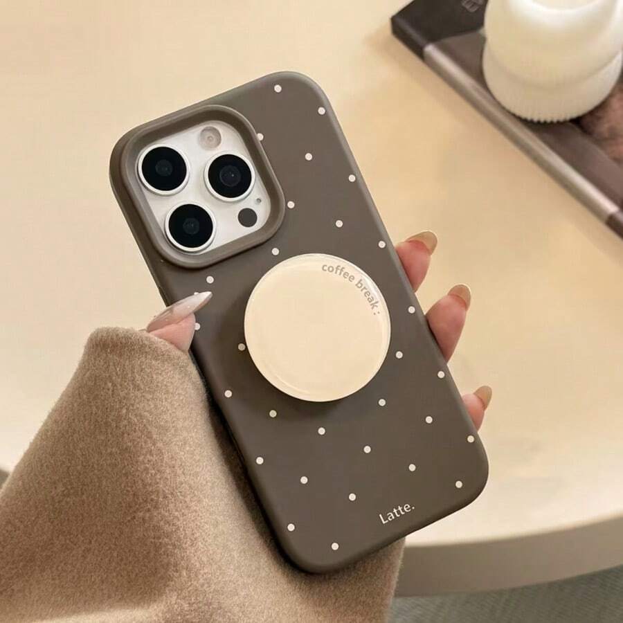 1个复古棕色英文圆形可伸缩折叠慵懒手机支架，兼容苹果手机，简约美学粘性支架